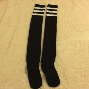 Thigh high socks. Black with white strips at top.